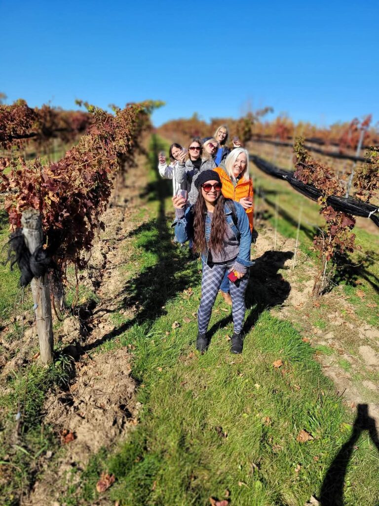 The girls having fun at the best winery in Norfolk County during the Harvest Hike at the Burning Kiln Winery