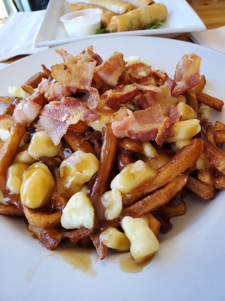 The bacon poutine is a nice addition to a fresh cocktail when visiting Locals.