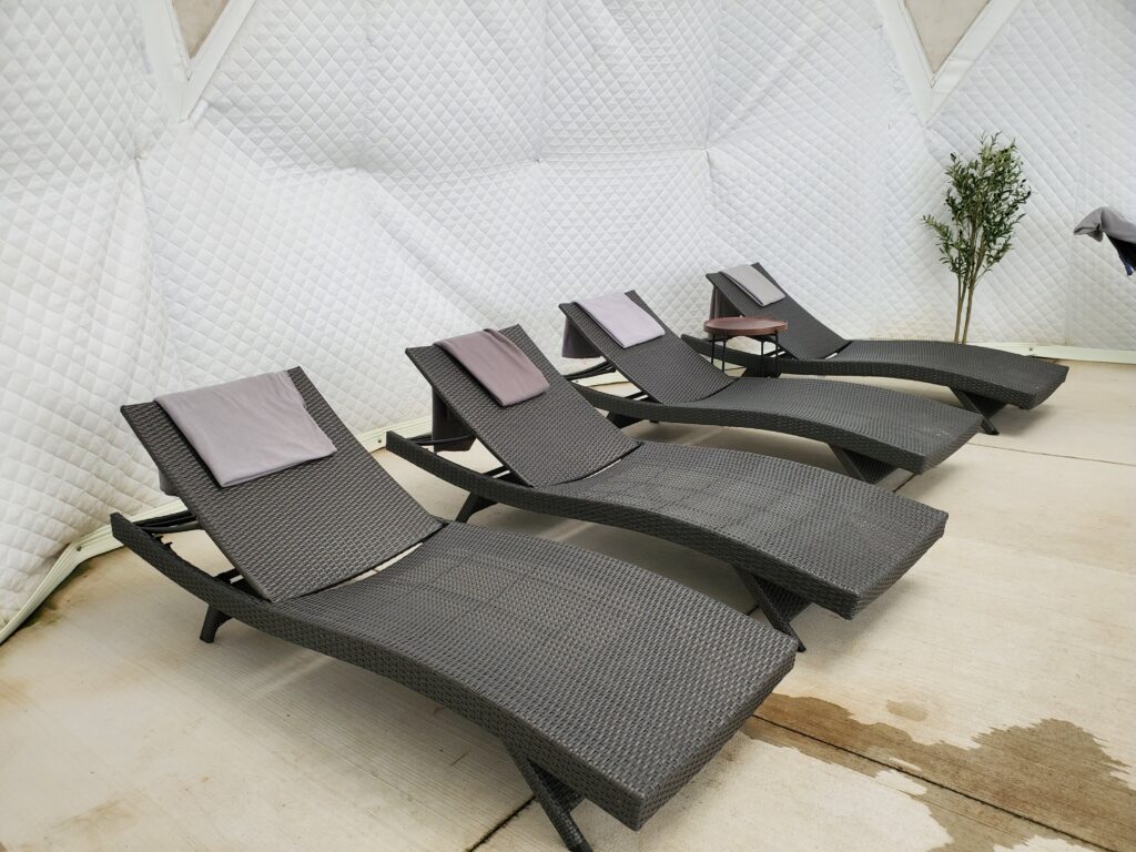 Relax in the comfort of a dome tent after experiencing the hot and cold plunge at Terra Nova Nordic Spa