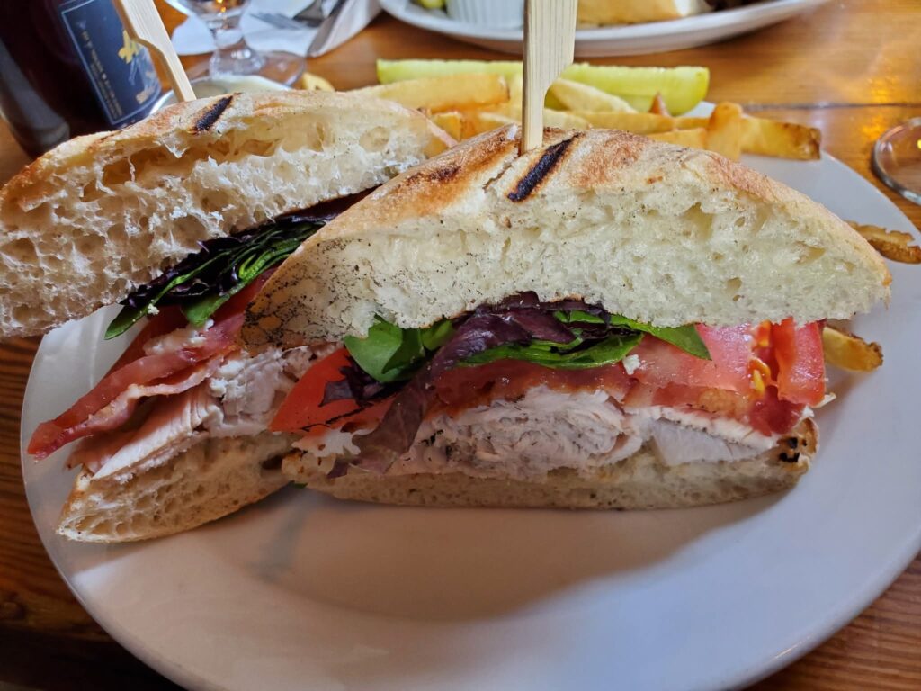 The Olde Angel Inn serves a fantastic clubhouse sandwich on a bun