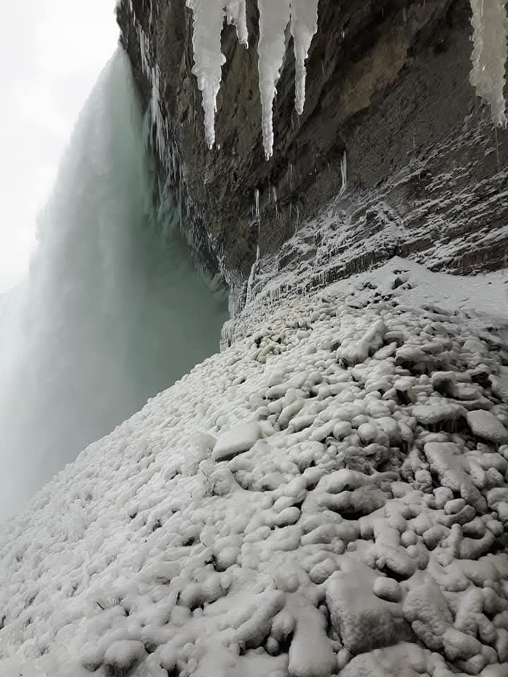 A journey behind the falls during an Ontario weekend winter getaway is magical and is a must do if you want to get close to the falls