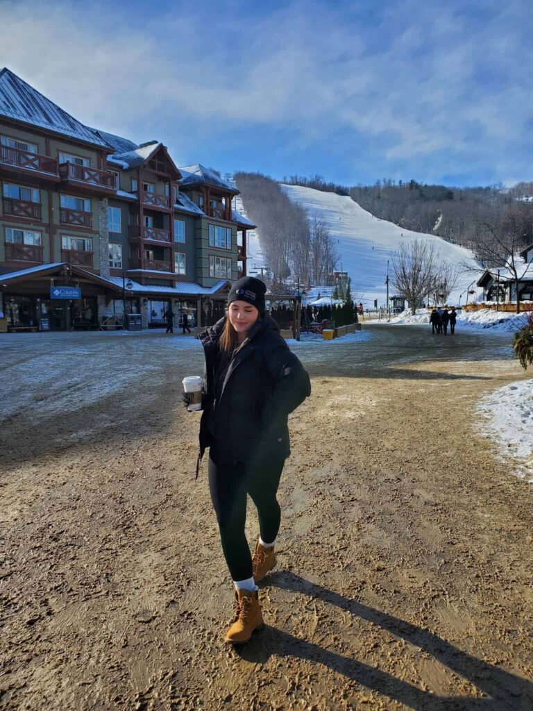 Enjoying a hot coffee to warm up while wondering the Blue Mountain Village during the Winter