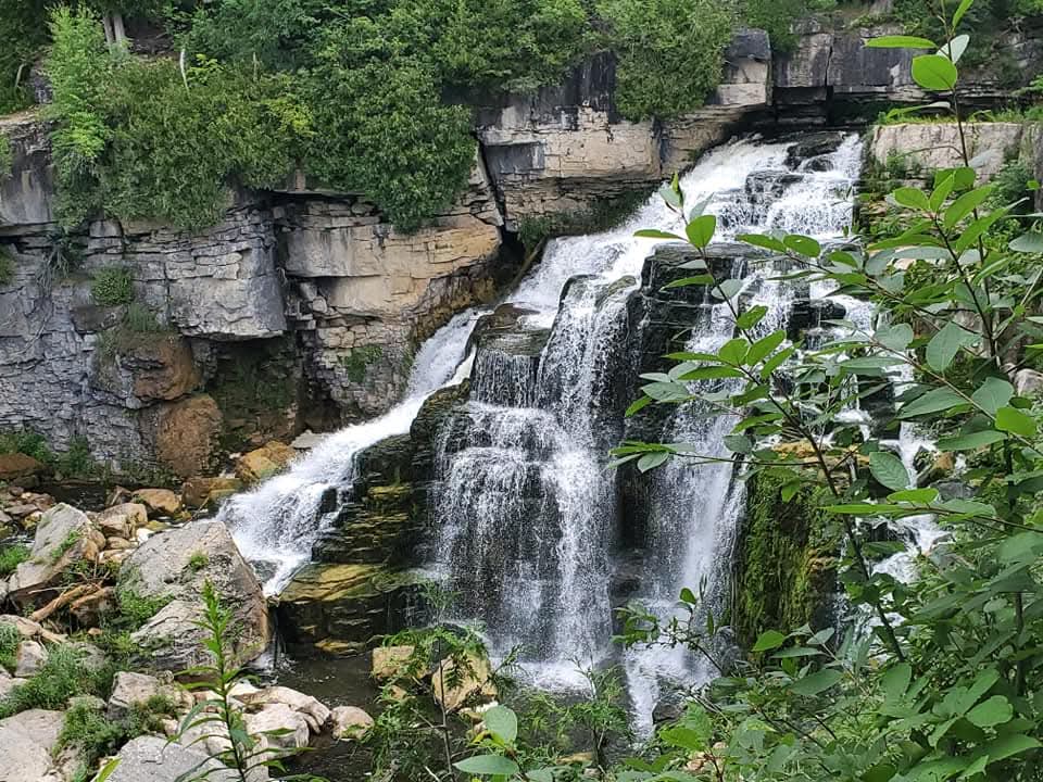 large cascade of water flowing over rocks makes Owen Sound the perfect destination to visit from Collingwood