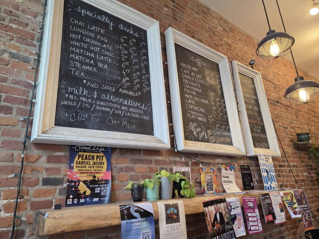 The coffee menu displayed on the wall inside the Kingston Coffee House