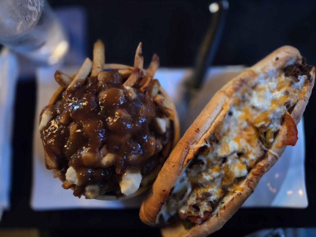 The cheese fillet steak sandwich and poutine served at Time Out are huge. There is no possible way to eat the entire thing