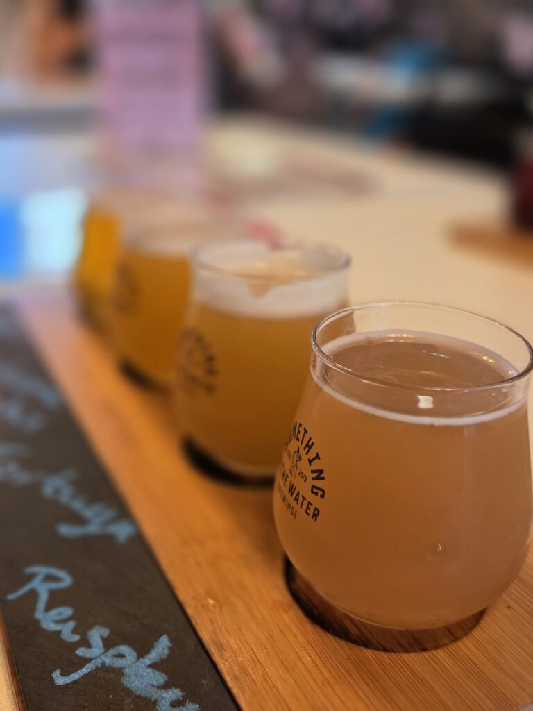 The tasting flight of craft beer served at Something in the Water is free when you purchase the Kingston K-Pass