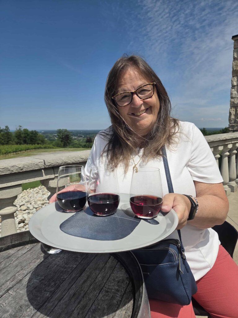 Me enjoying a flight of wine on the patio at a winery in the Niagara Benchlands on a beautiful afternoon