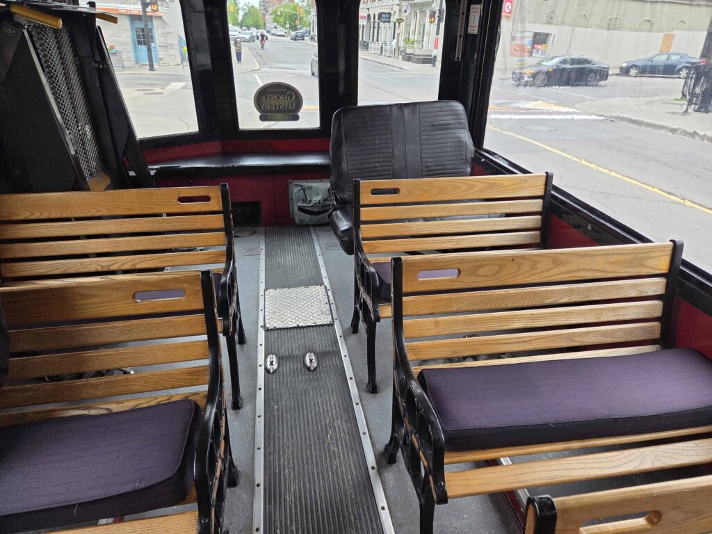 the inside of the hop on hop off trolley in Kingston offers plenty of room for tourists visiting the city
