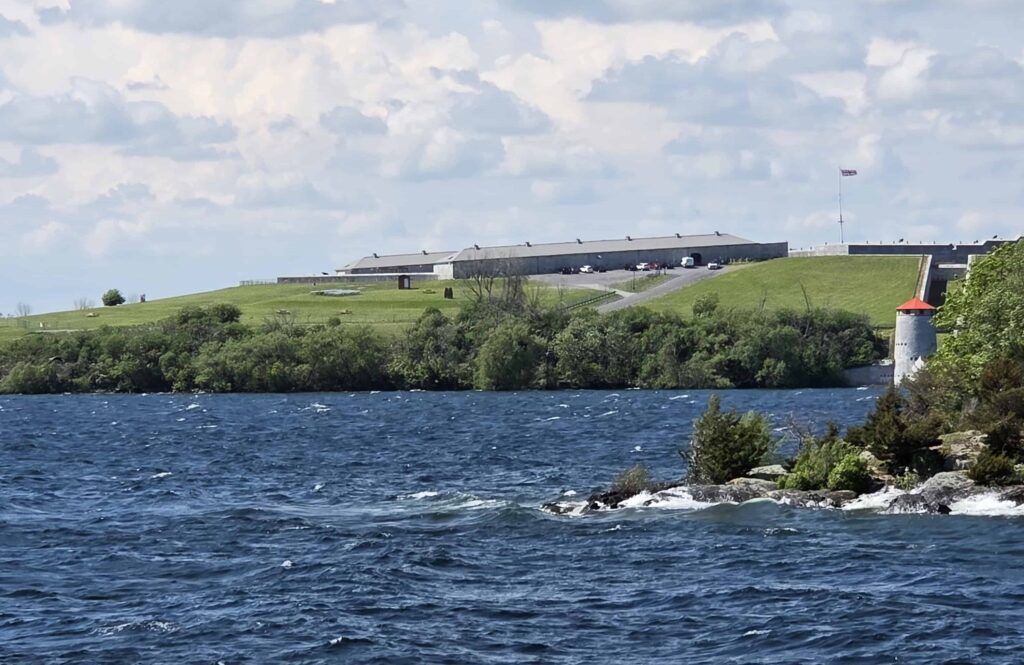 Looking at Fort Henry perched high on a hill from a 1000 Island cruise