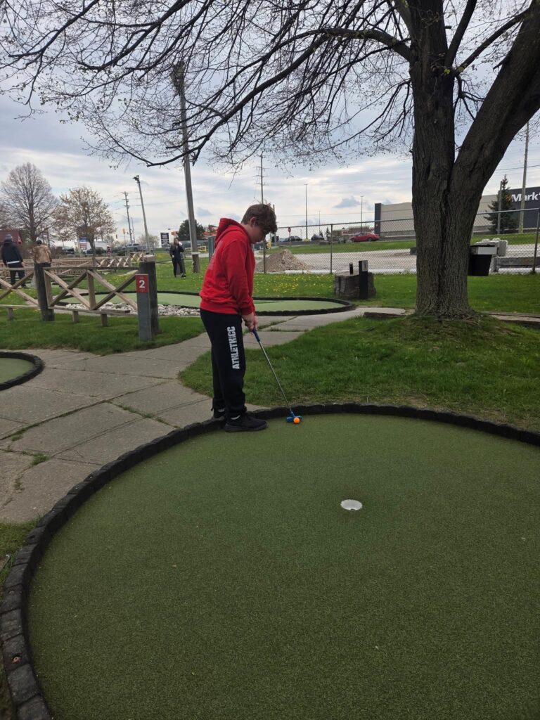 My grandson playing mini golf at Market Sports in Waterloo